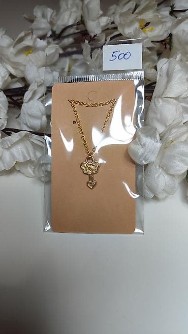 Zlatno obojena ogrlica sa priveskom u obliku ključa. Privjesak je na lalafo.rs Zlatno obojena ogrlica sa priveskom u obliku ključa. Privjesak je