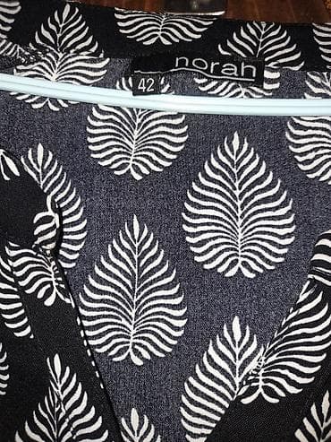 Ženska bluza Norah, veličina 42. Crna podloga sa belim listićima u na lalafo.rs — 2 Ženska bluza Norah, veličina 42. Crna podloga sa belim listićima u — 2