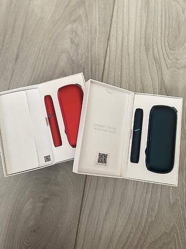 Dva IQOS-a, crveni i crni, uz njih punjači i čistači, u ispravnom na lalafo.rs Dva IQOS-a, crveni i crni, uz njih punjači i čistači, u ispravnom