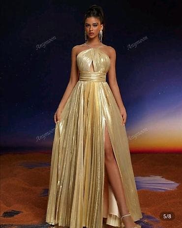 Zlatna večernja haljina – duga, plisirana, sa visokim sjajem. Haljina na lalafo.rs Zlatna večernja haljina – duga, plisirana, sa visokim sjajem. Haljina