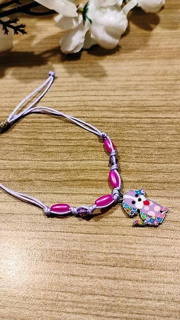 Narukvica sa priveškom – ljubičasta - Ručno pletena narukvica od na lalafo.rs — 1 Narukvica sa priveškom – ljubičasta - Ručno pletena narukvica od — 1