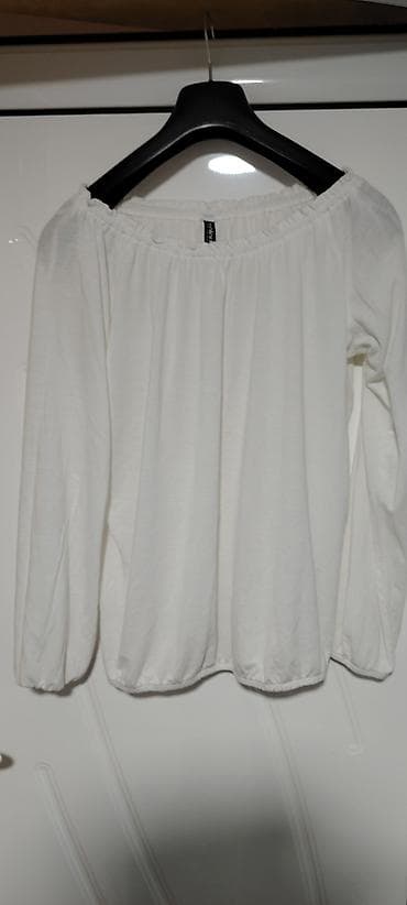 Bela ženska bluza sa dugim rukavima i elastičnim rubovima. Model sa na lalafo.rs Bela ženska bluza sa dugim rukavima i elastičnim rubovima. Model sa