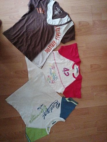 Tri ženske majice kratkih rukava različitih dezena. Jedna majica je na lalafo.rs — 1 Tri ženske majice kratkih rukava različitih dezena. Jedna majica je — 1