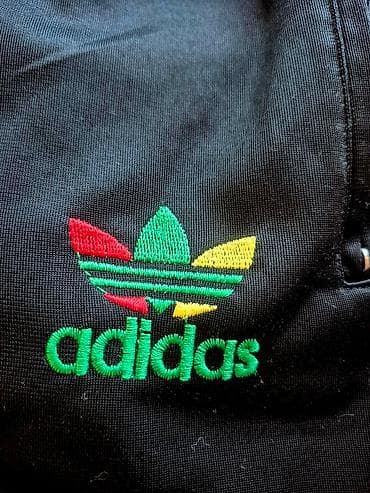 Crne sportske trenerke sa prugama u bojama žuto–zeleno–crveno duž at lalafo.rs — 4 Crne sportske trenerke sa prugama u bojama žuto–zeleno–crveno duž — 4