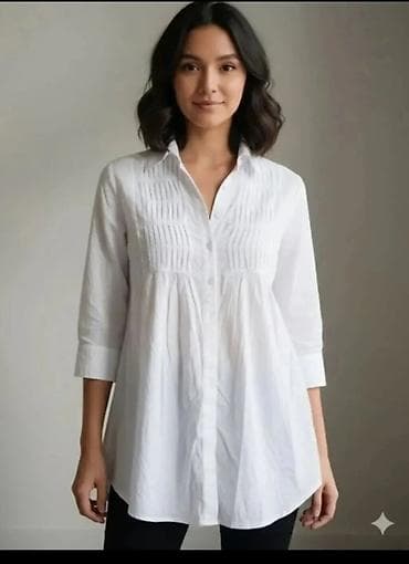 Bela ženska košulja-tunika - Kroj: opuštena tunika dužine preko na lalafo.rs Bela ženska košulja-tunika - Kroj: opuštena tunika dužine preko