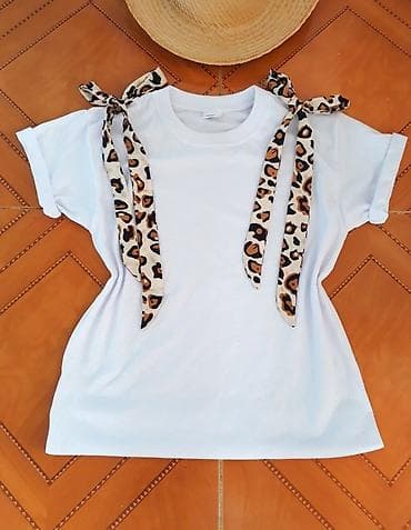 Majica sirkasta sa podvijenim rukavima.Ima dve trake leopard print na na lalafo.rs — 1 Majica sirkasta sa podvijenim rukavima.Ima dve trake leopard print na — 1