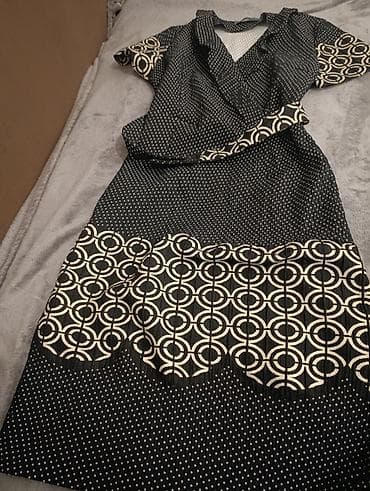 Elegantna teget haljina na tufnice sa kontrastnim geometrijskim na lalafo.rs — 1 Elegantna teget haljina na tufnice sa kontrastnim geometrijskim — 1