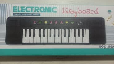 Muzički instrumenti za decu: Sintisajzer za decu sa mikrofonom - 32 dirke - 8 demo pesama - 8 na lalafo.rs — 3 Muzički instrumenti za decu: Sintisajzer za decu sa mikrofonom - 32 dirke - 8 demo pesama - 8 — 3