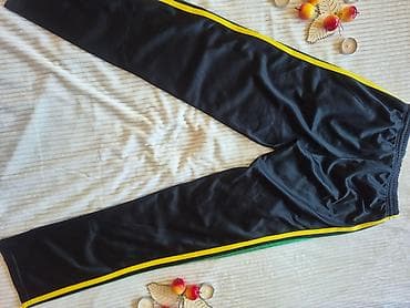 Crne sportske trenerke sa prugama u bojama žuto–zeleno–crveno duž at lalafo.rs — 2 Crne sportske trenerke sa prugama u bojama žuto–zeleno–crveno duž — 2