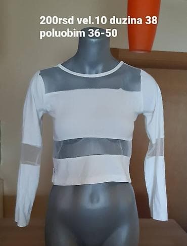 Beli crop top sa dugim rukavima, brenda STRIP. Model ima prozirne na lalafo.rs — 1 Beli crop top sa dugim rukavima, brenda STRIP. Model ima prozirne — 1