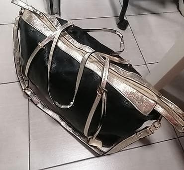 Crna ženska torba sa zlatnim detaljima. Ima dve ručke za nošenje u na lalafo.rs — 1 Crna ženska torba sa zlatnim detaljima. Ima dve ručke za nošenje u — 1