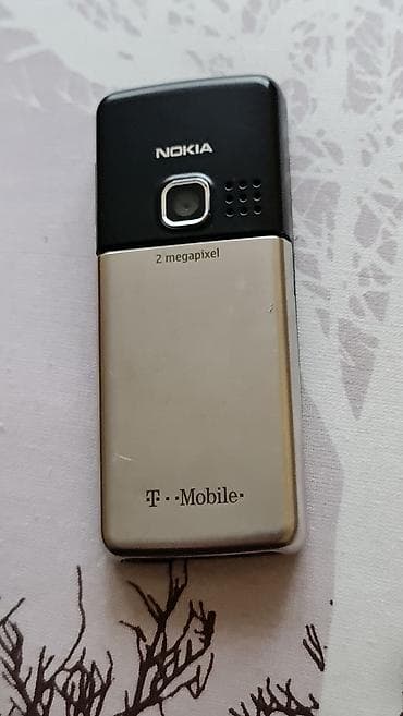 kom sa etiketom: Nokia klasični mobilni telefon sa tastaturom - Model sa T‑Mobile at lalafo.rs — 2 kom sa etiketom: Nokia klasični mobilni telefon sa tastaturom - Model sa T‑Mobile — 2