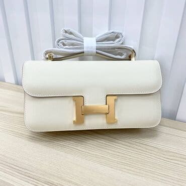 Elegantna ženska torba od teksturirane kože u boji slonovače, sa na lalafo.rs Elegantna ženska torba od teksturirane kože u boji slonovače, sa