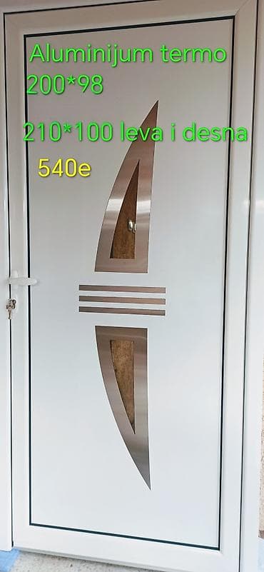 Aluminijumska termo ulazna vrata sa modernim dekorativnim inox na lalafo.rs Aluminijumska termo ulazna vrata sa modernim dekorativnim inox
