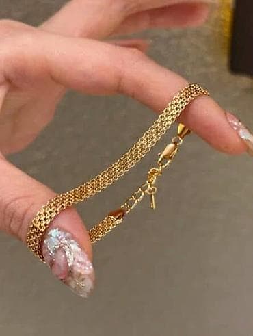 Zlatno-tonirana ženska ogrlica sa pletenim lancem Cena 1600din Idealna na lalafo.rs — 4 Zlatno-tonirana ženska ogrlica sa pletenim lancem Cena 1600din Idealna — 4