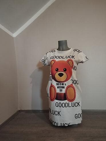 Haljina/tunika sa kratkim rukavima i okruglim izrezom, bela osnova na lalafo.rs Haljina/tunika sa kratkim rukavima i okruglim izrezom, bela osnova