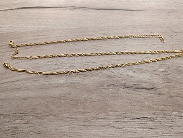Zlatnožuta ženska ogrlica – pletena/savijena karika - Materijal na lalafo.rs Zlatnožuta ženska ogrlica – pletena/savijena karika - Materijal