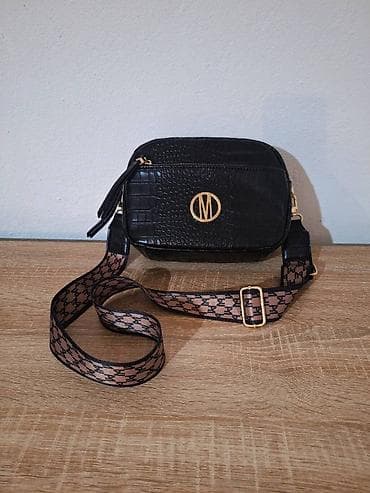 Nova Mohito crna torbica dva kaiša, širok kaiš preko ramena Nova at lalafo.rs — 1 Nova Mohito crna torbica dva kaiša, širok kaiš preko ramena Nova — 1