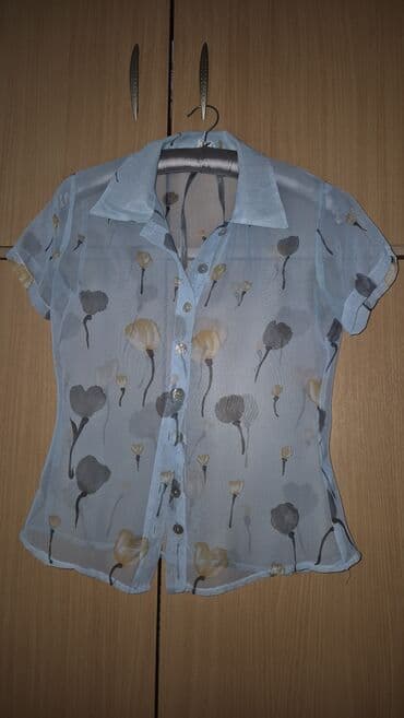 Providna ženska košulja kratkih rukava, svetloplave boje sa sitnim na lalafo.rs Providna ženska košulja kratkih rukava, svetloplave boje sa sitnim