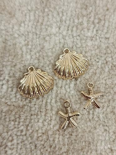 4 Priveska, morske zvezde i školjke, sve za 200 dinara na lalafo.rs — 1 4 Priveska, morske zvezde i školjke, sve za 200 dinara — 1